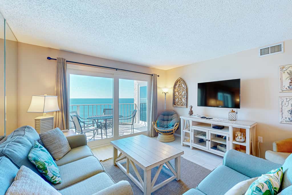 Stunning beachfront condo w/ beach access, shared pool, & private balcony