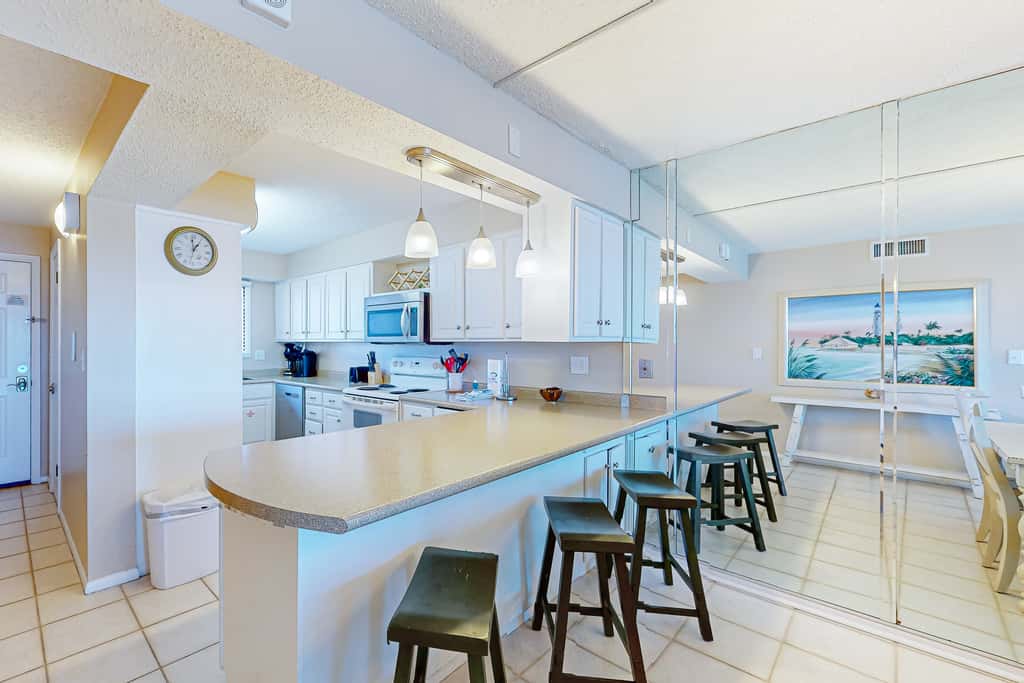 Stunning beachfront condo w/ beach access, shared pool, & private balcony