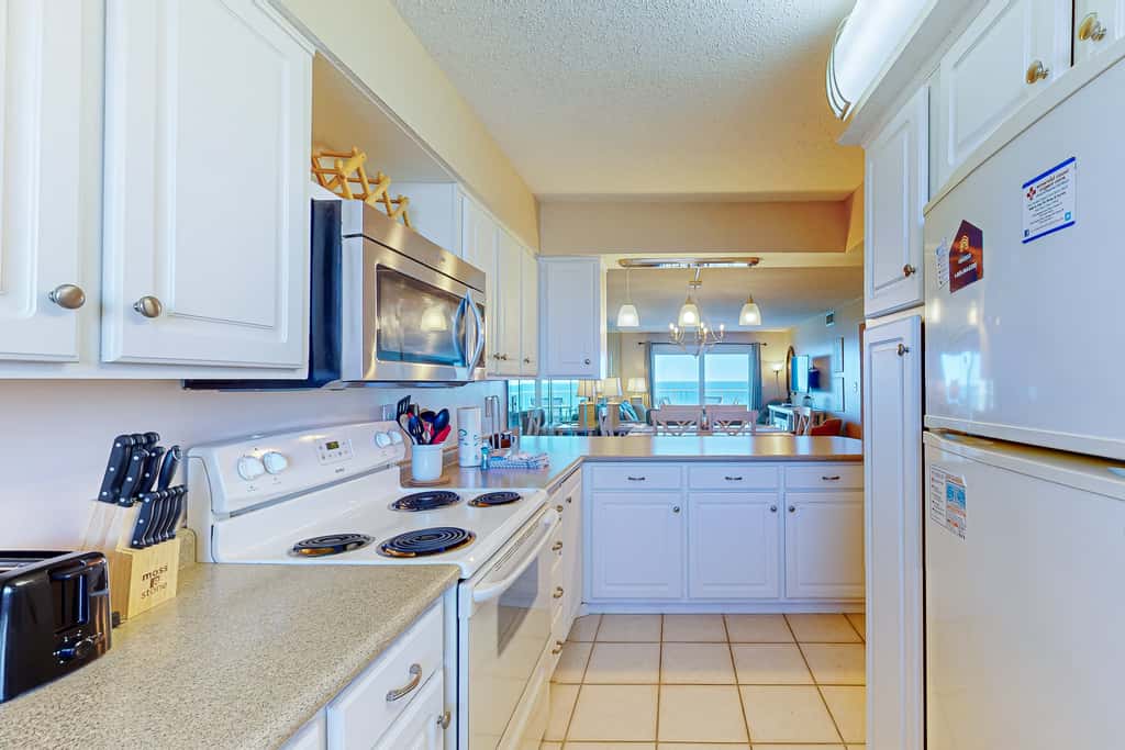Stunning beachfront condo w/ beach access, shared pool, & private balcony
