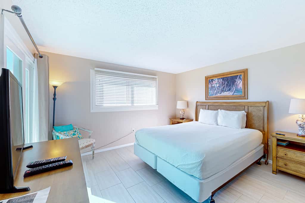 Stunning beachfront condo w/ beach access, shared pool, & private balcony