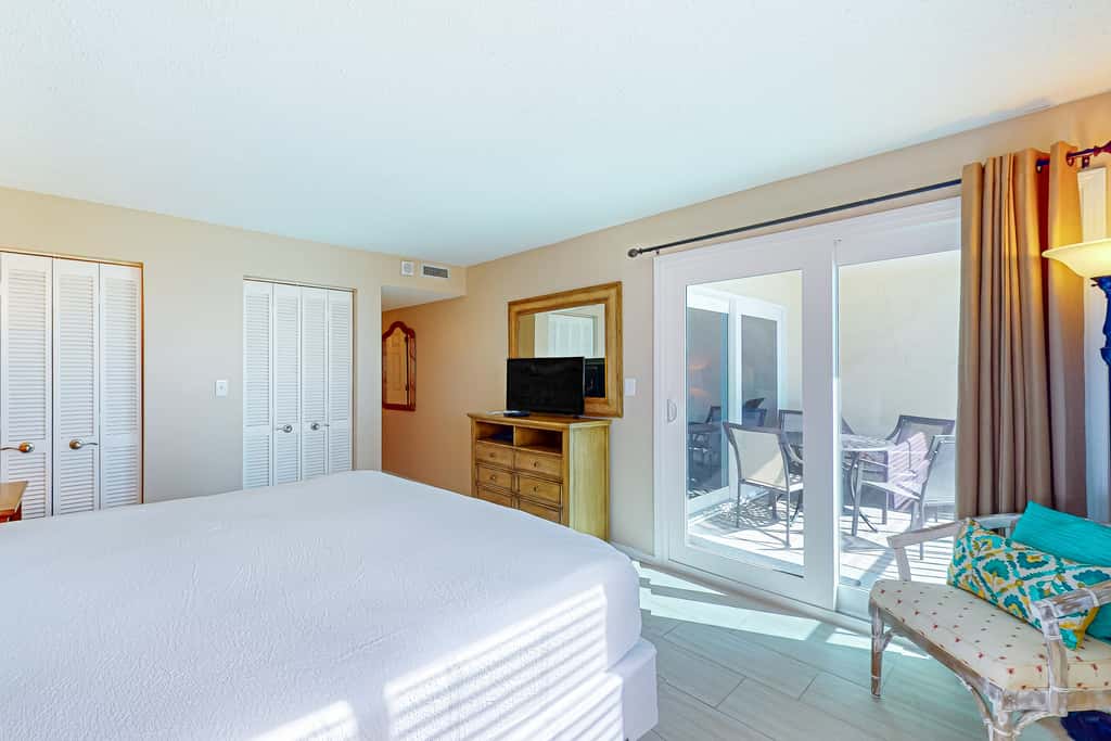 Stunning beachfront condo w/ beach access, shared pool, & private balcony