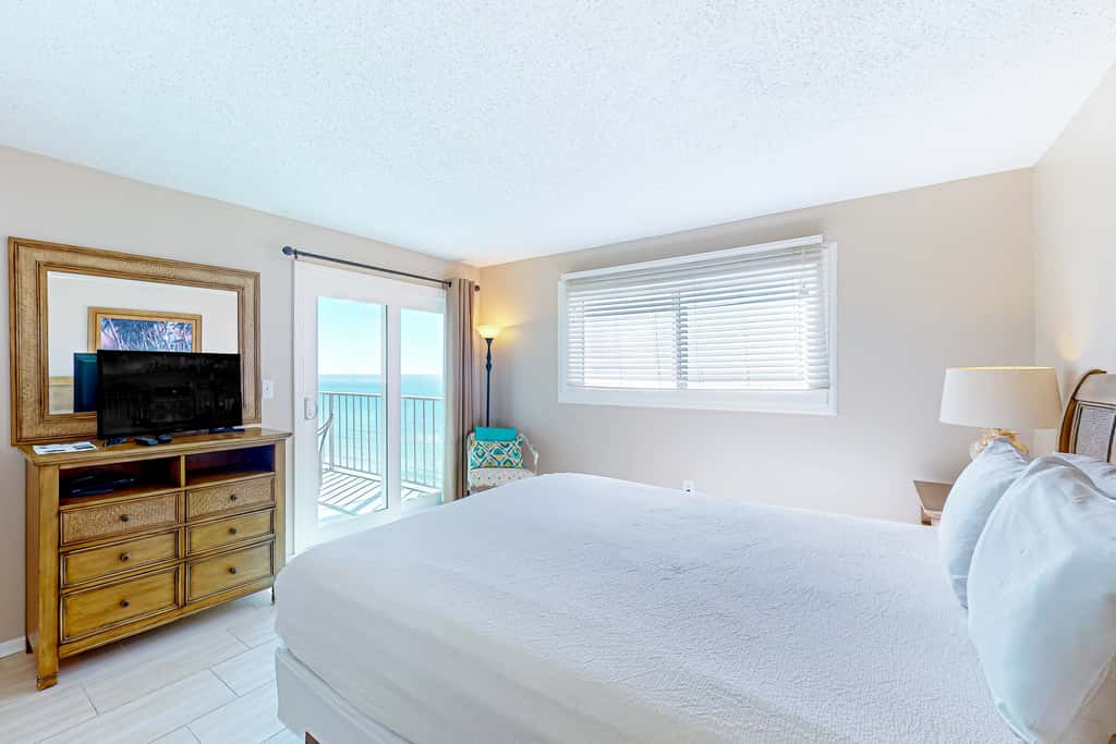 Stunning beachfront condo w/ beach access, shared pool, & private balcony