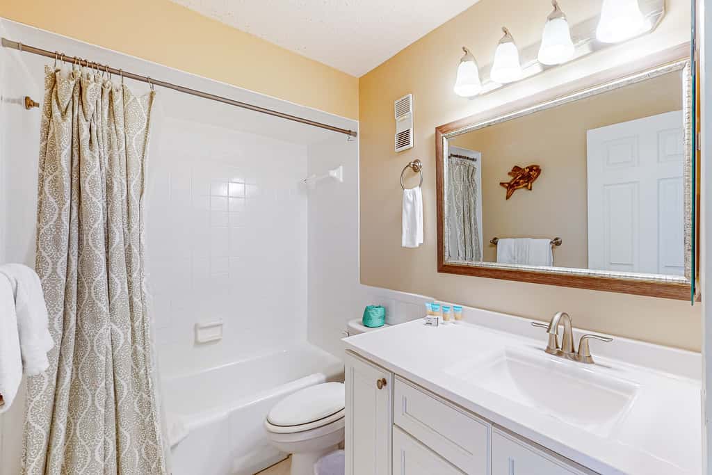 Stunning beachfront condo w/ beach access, shared pool, & private balcony