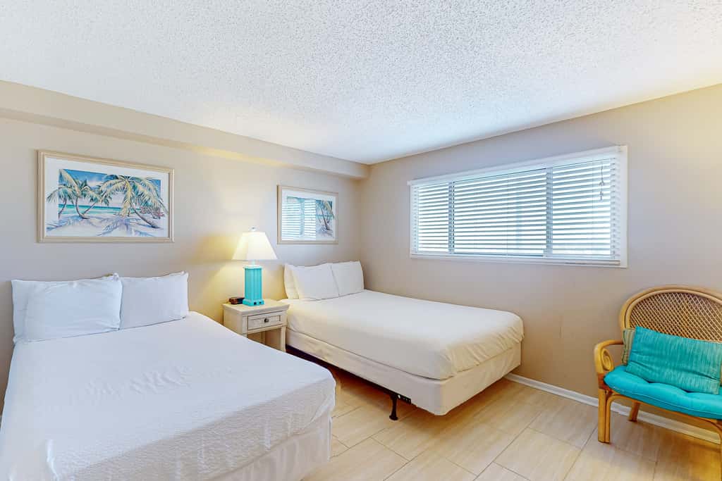 Stunning beachfront condo w/ beach access, shared pool, & private balcony