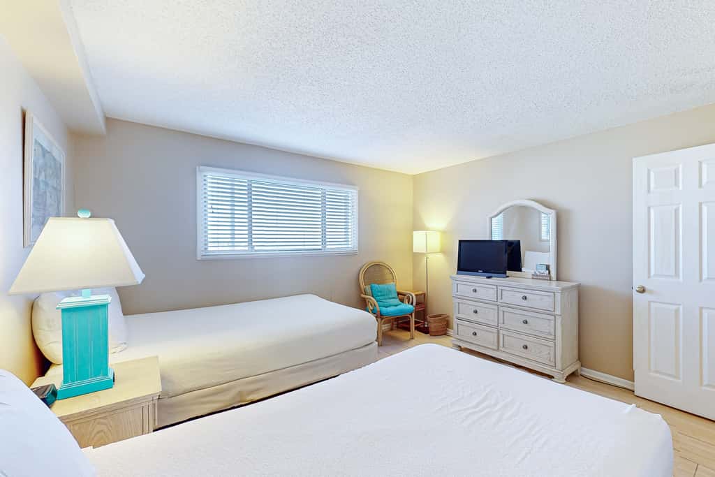 Stunning beachfront condo w/ beach access, shared pool, & private balcony