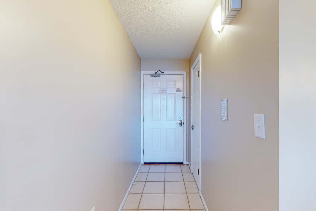 Stunning beachfront condo w/ beach access, shared pool, & private balcony