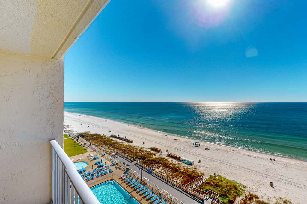 Stunning beachfront condo w/ beach access, shared pool, & private balcony