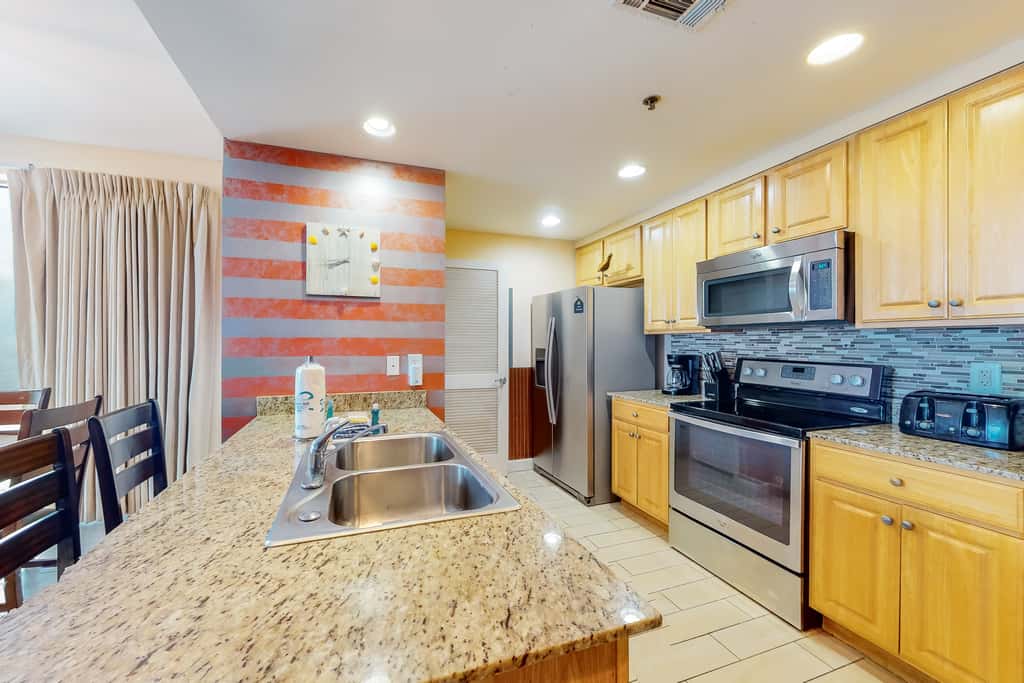 Superb beach living at lovely waterfront condo with pools, a gym, & hot tub