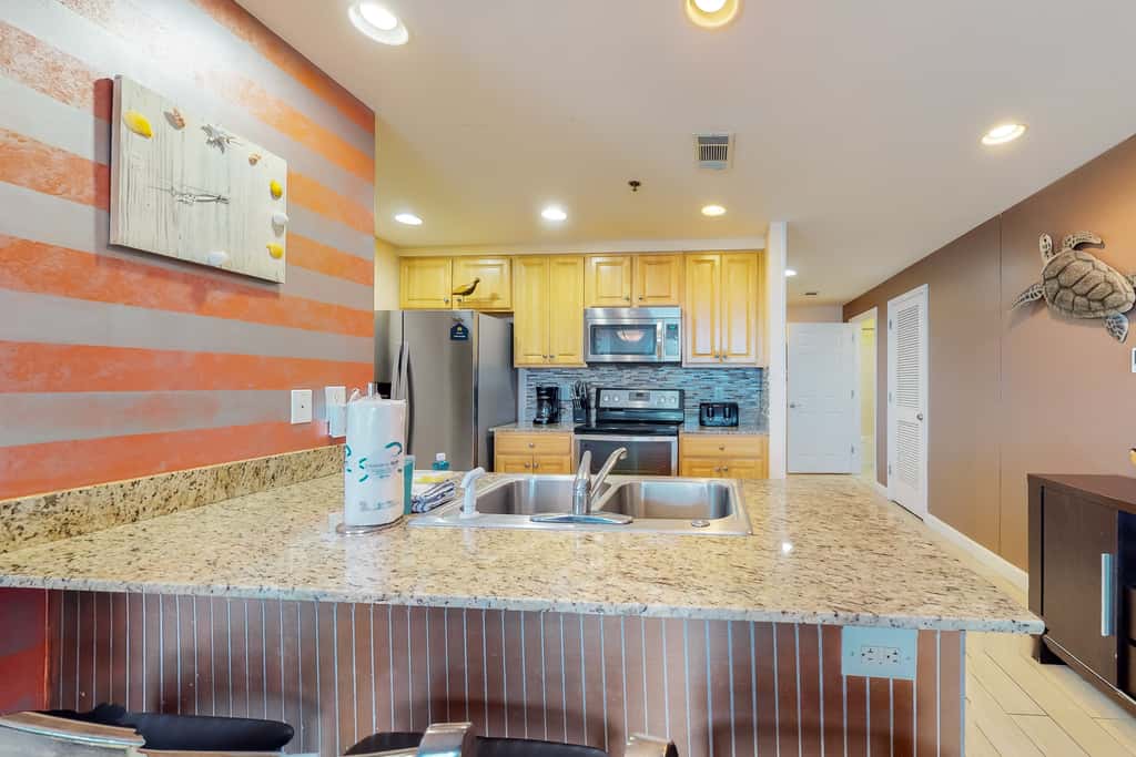 Superb beach living at lovely waterfront condo with pools, a gym, & hot tub