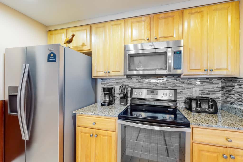 Superb beach living at lovely waterfront condo with pools, a gym, & hot tub