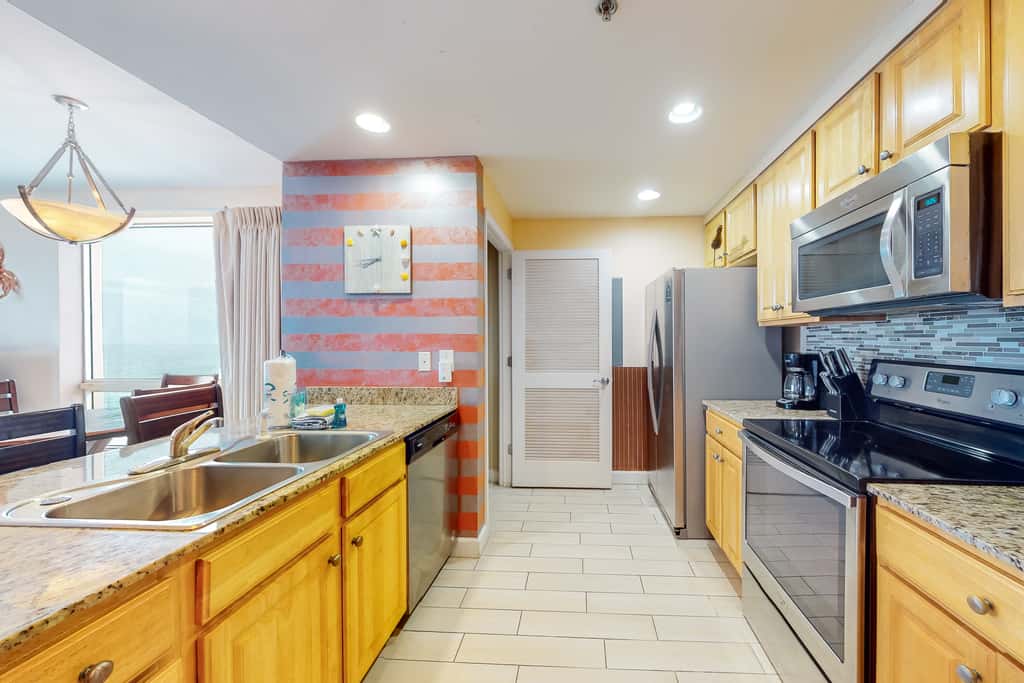 Superb beach living at lovely waterfront condo with pools, a gym, & hot tub