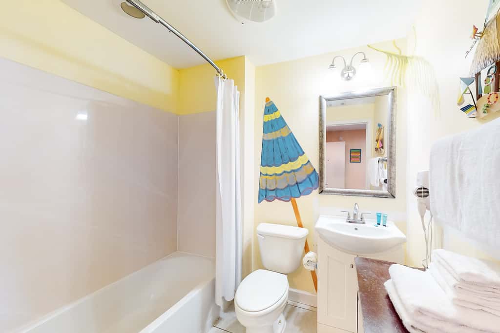 Superb beach living at lovely waterfront condo with pools, a gym, & hot tub