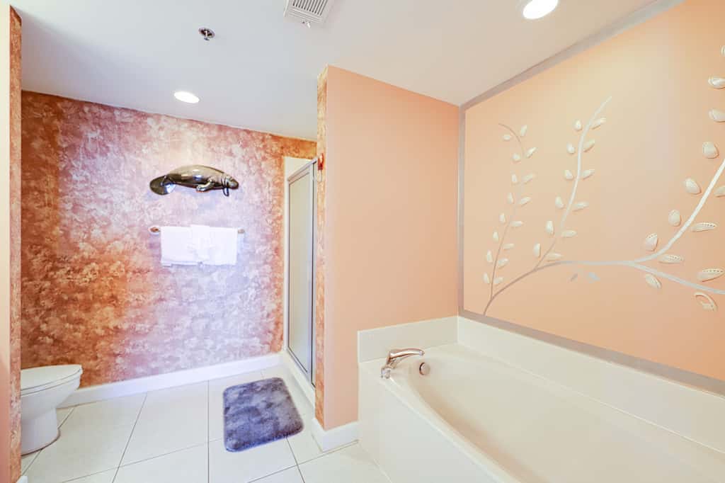 Superb beach living at lovely waterfront condo with pools, a gym, & hot tub