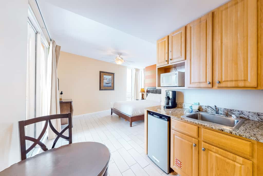 Superb beach living at lovely waterfront condo with pools, a gym, & hot tub