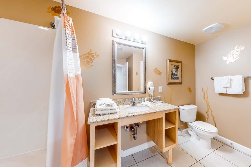 Superb beach living at lovely waterfront condo with pools, a gym, & hot tub