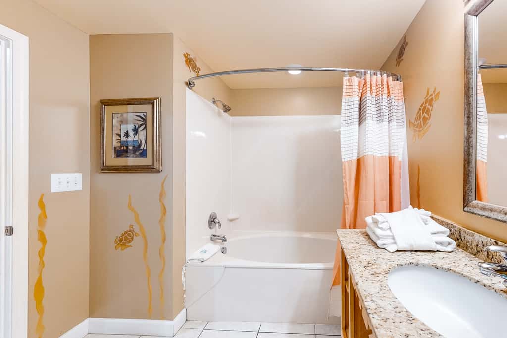 Superb beach living at lovely waterfront condo with pools, a gym, & hot tub