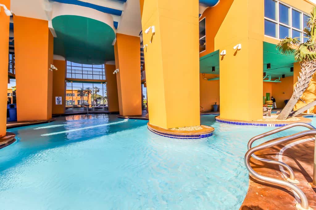 Superb beach living at lovely waterfront condo with pools, a gym, & hot tub