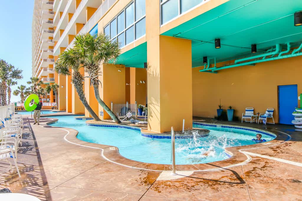 Superb beach living at lovely waterfront condo with pools, a gym, & hot tub