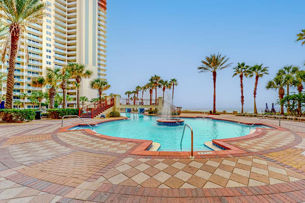 Gulf-front condo with sweeping views, pools, hot tubs, & easy beach