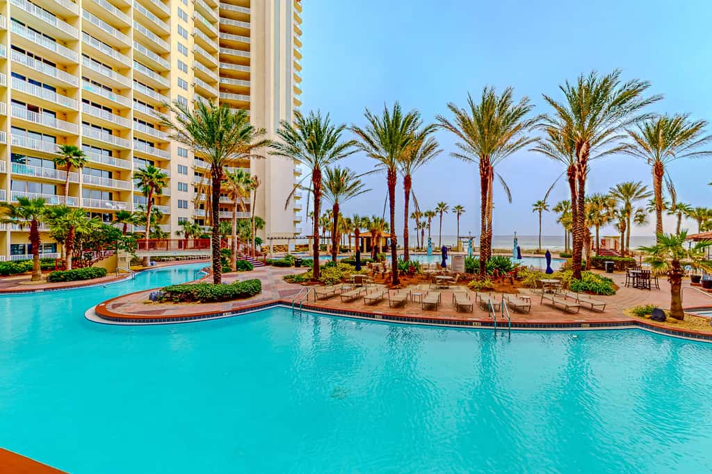 Gulf-front condo with sweeping views, pools, hot tubs, & easy beach