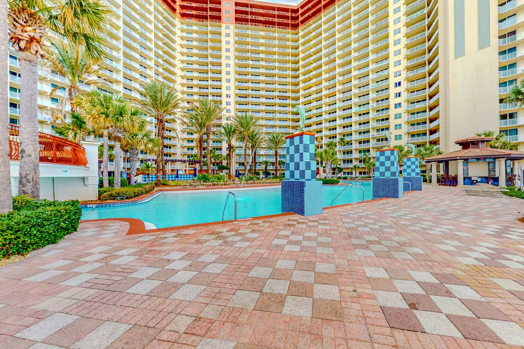 Gulf-front condo with sweeping views, pools, hot tubs, & easy beach
