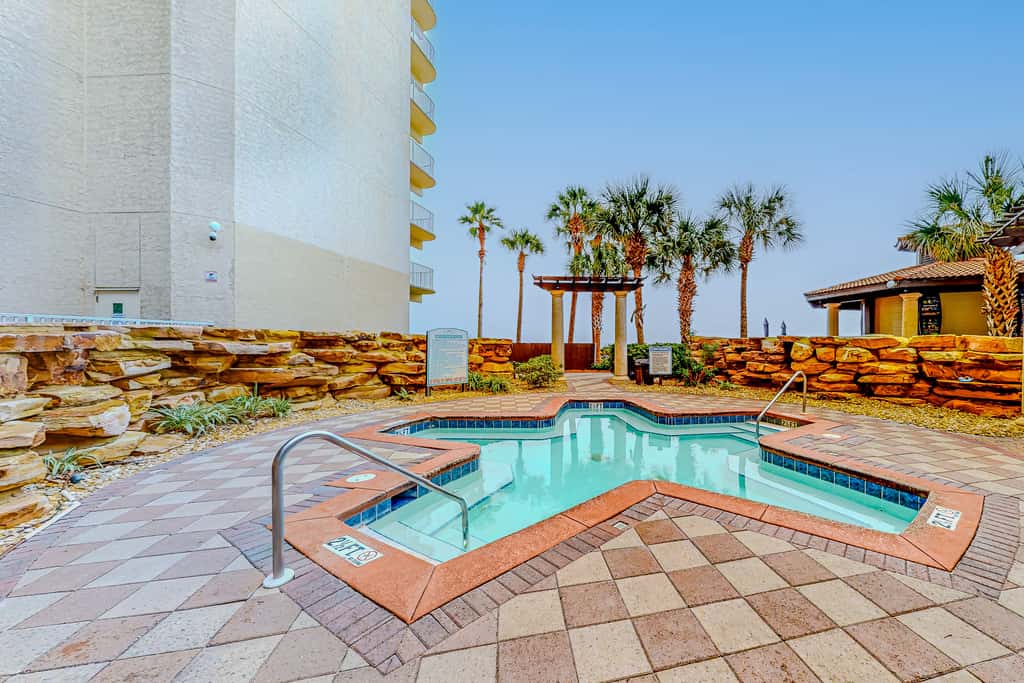 Gulf-front condo with sweeping views, pools, hot tubs, & easy beach