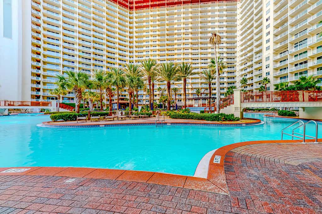 Gulf-front condo with sweeping views, pools, hot tubs, & easy beach