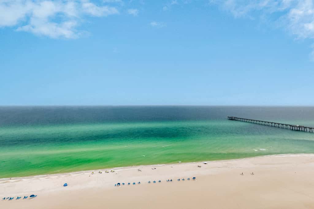 14th-floor oceanfront condo with Gulf views, outdoor pool, balcony, WD, & AC