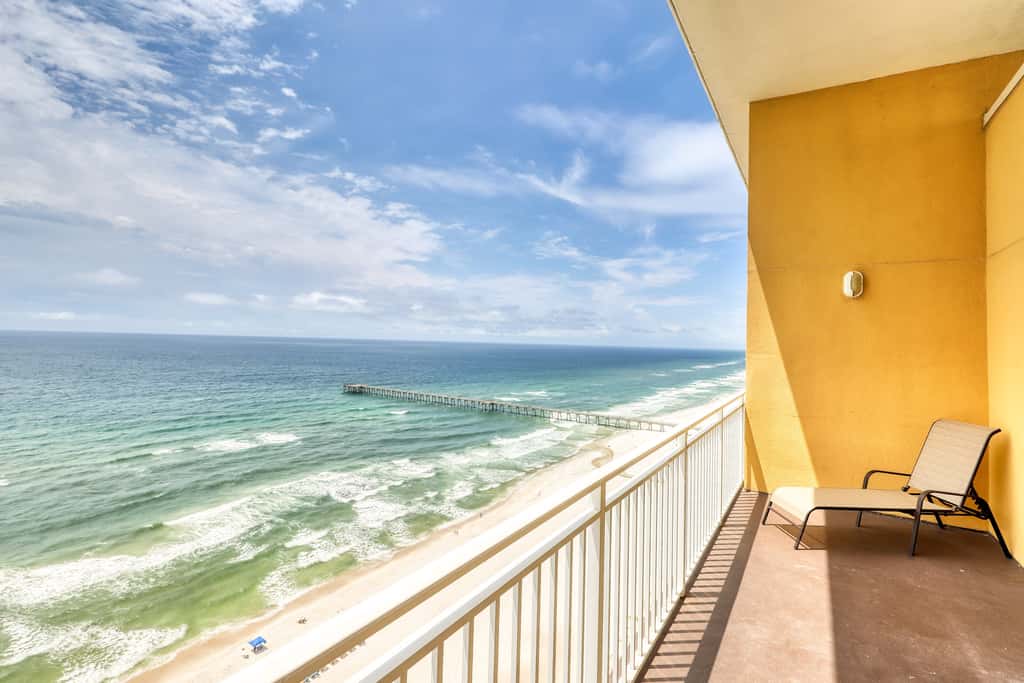 Waterfront condo with furnished balcony, pool, gym & beach