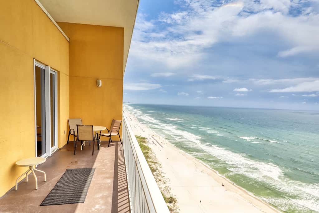 Waterfront condo with furnished balcony, pool, gym & beach