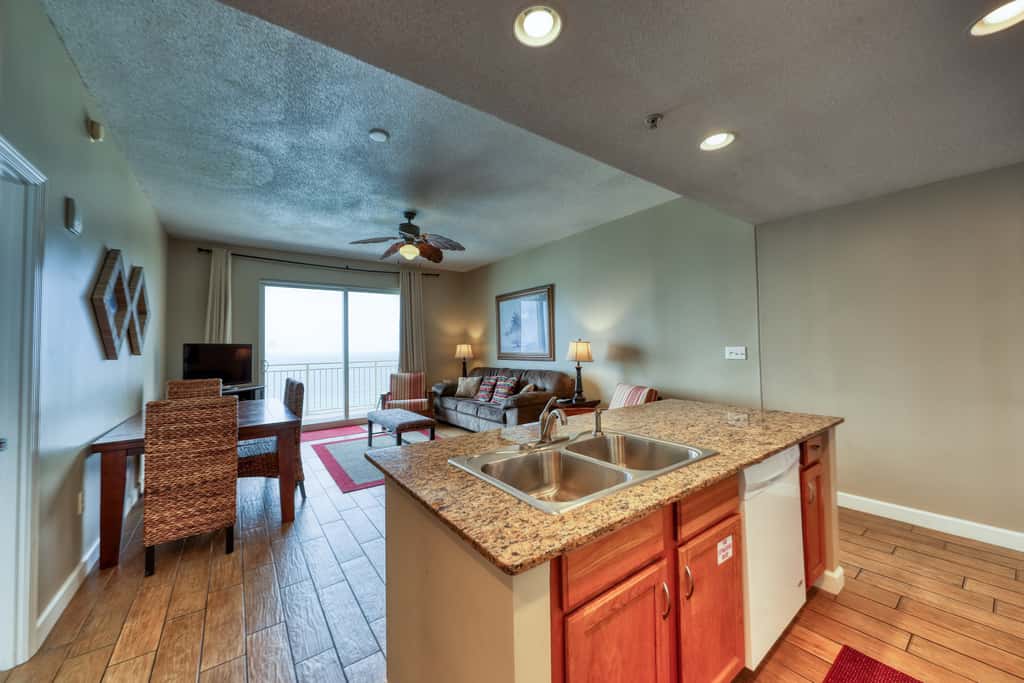 Waterfront condo with furnished balcony, pool, gym & beach