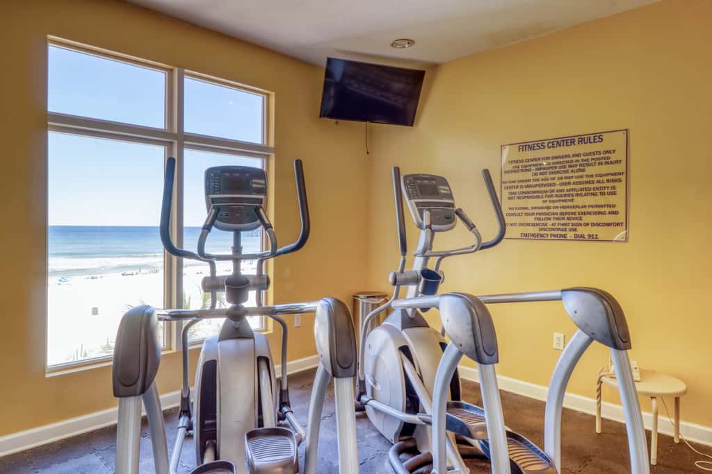 Waterfront condo with furnished balcony, pool, gym & beach
