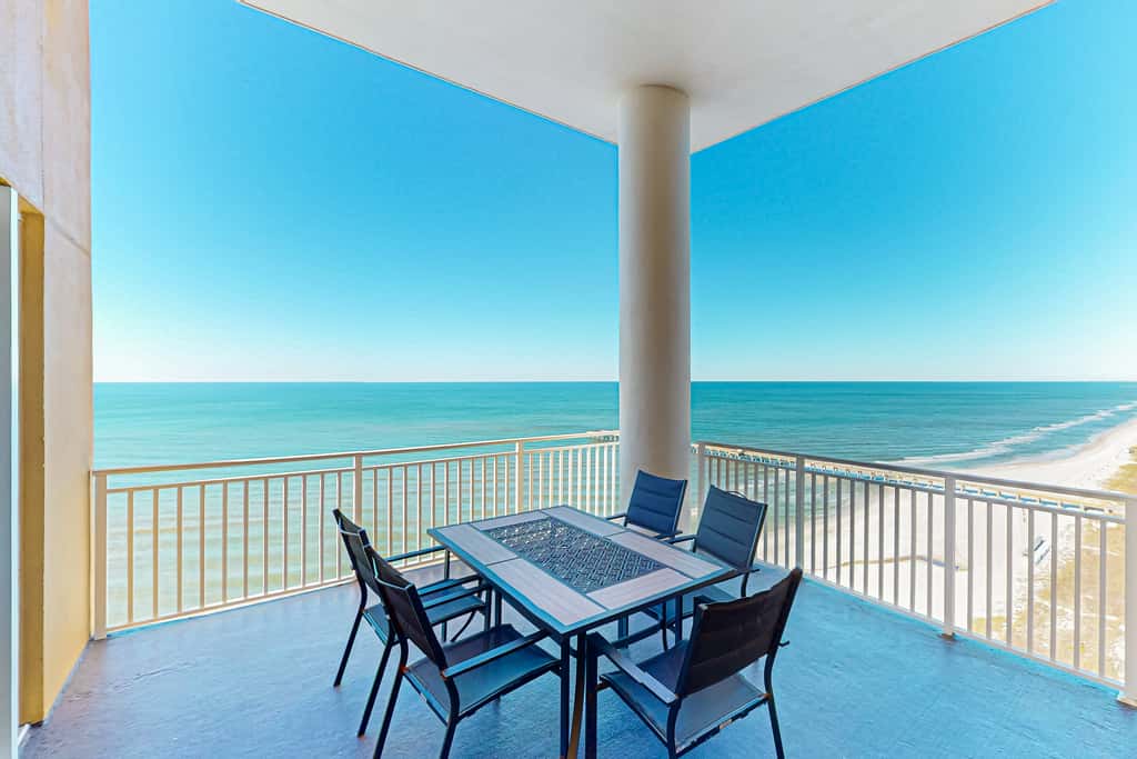 High-end beachfront condo with pools & gym - walk to the beach