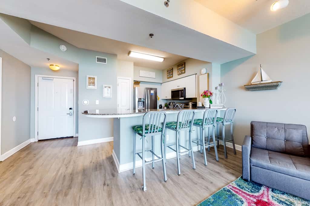 Updated beachfront condo with pool, hot tub, WD, & central AC