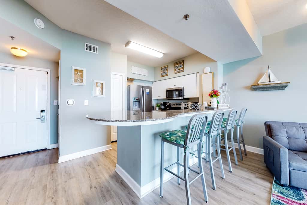 Updated beachfront condo with pool, hot tub, WD, & central AC