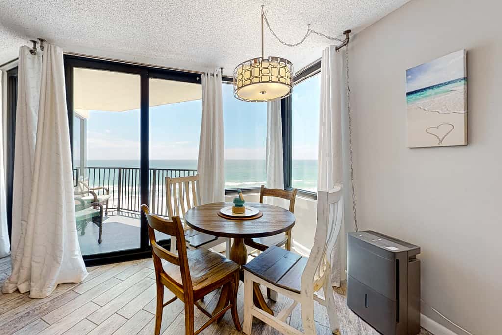 Gulf-view condo with pools, beach access, gym, grills, & updated interior