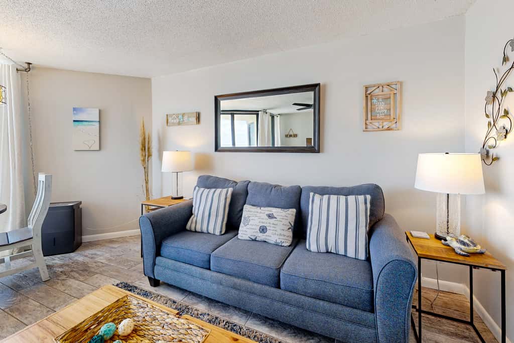 Gulf-view condo with pools, beach access, gym, grills, & updated interior