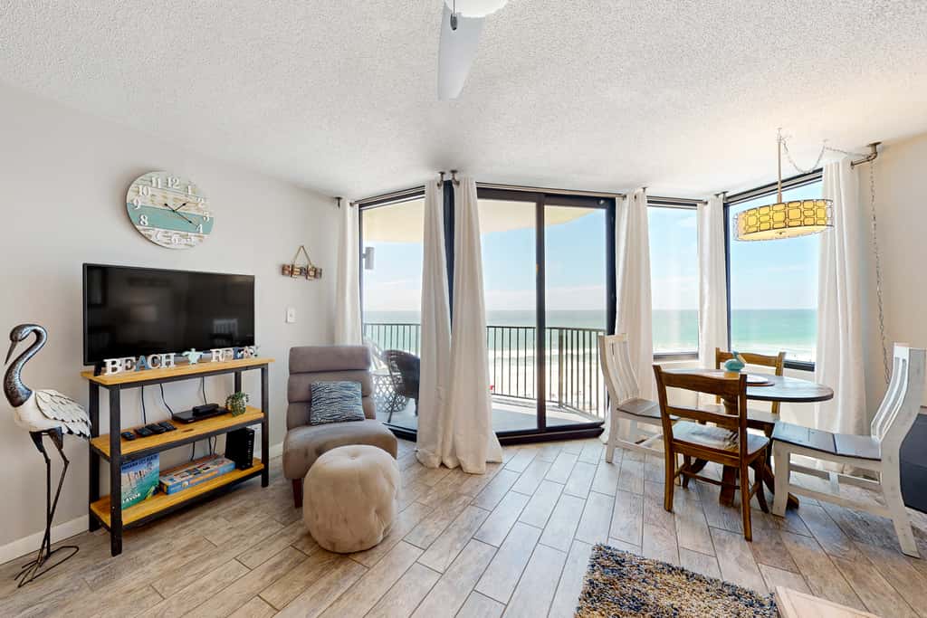 Gulf-view condo with pools, beach access, gym, grills, & updated interior