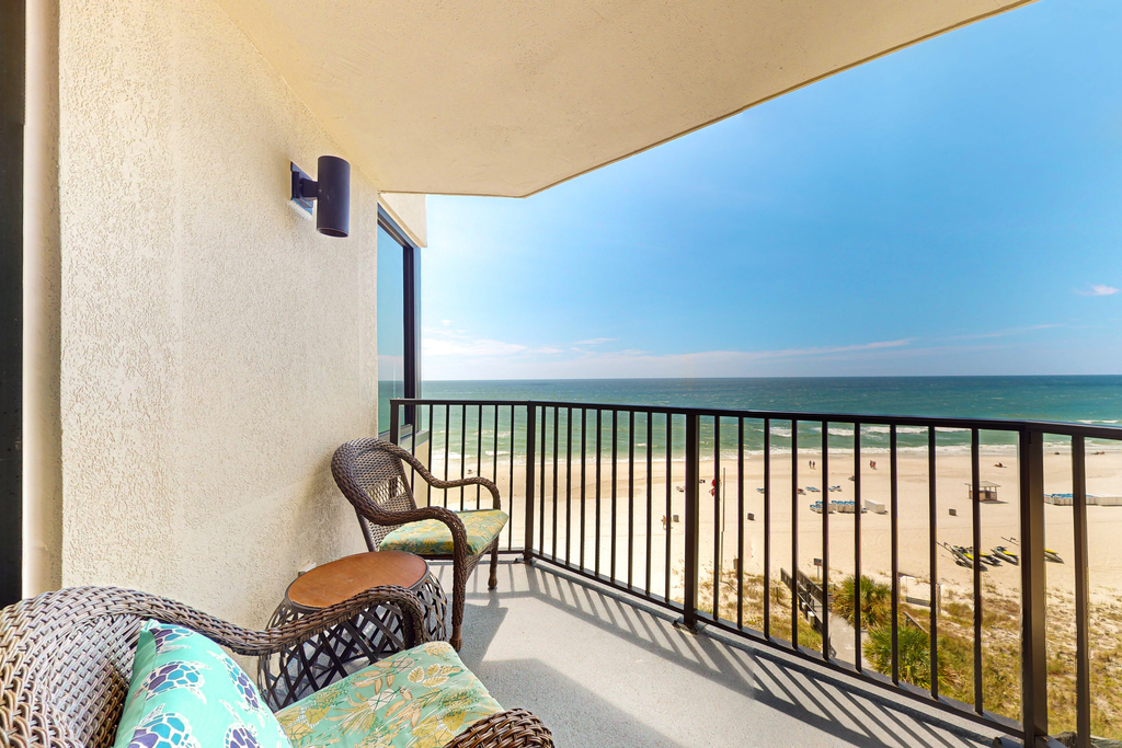 Gulf-view condo with pools, beach access, gym, grills, & updated interior