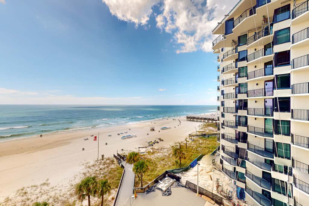 Gulf-view condo with pools, beach access, gym, grills, & updated interior