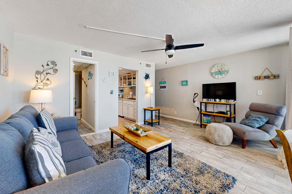 Gulf-view condo with pools, beach access, gym, grills, & updated interior