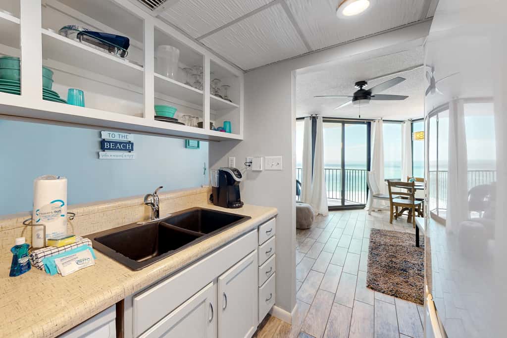 Gulf-view condo with pools, beach access, gym, grills, & updated interior