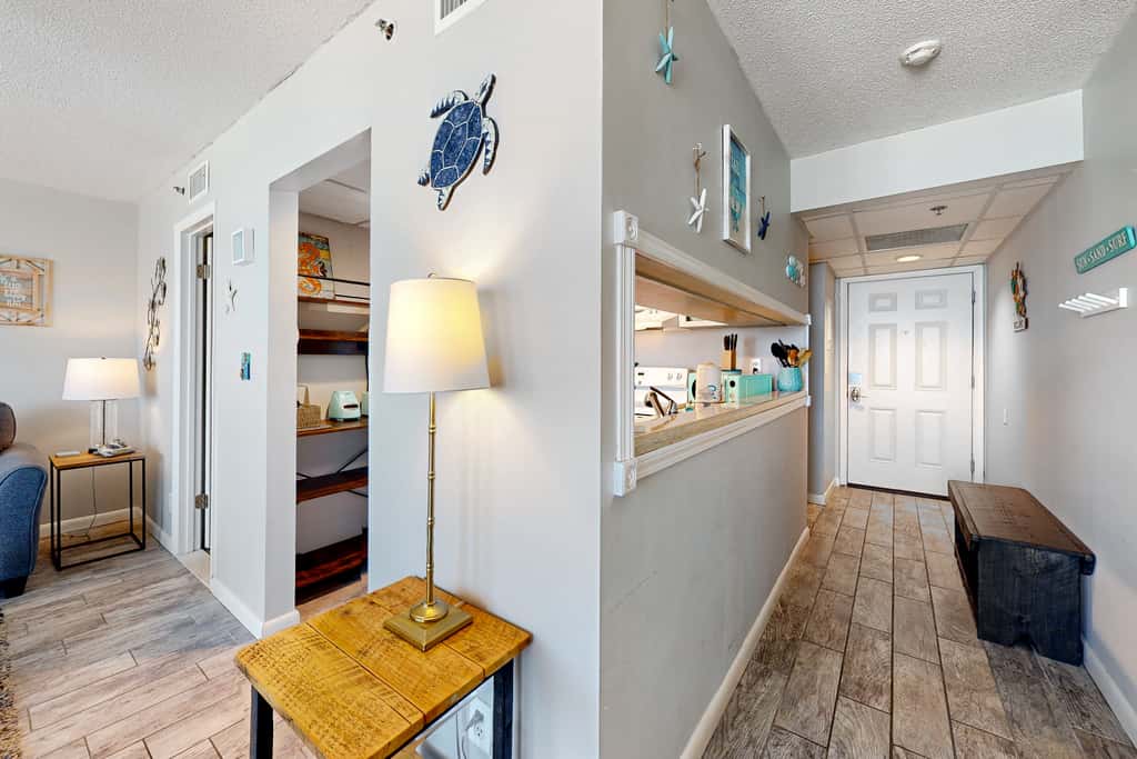 Gulf-view condo with pools, beach access, gym, grills, & updated interior