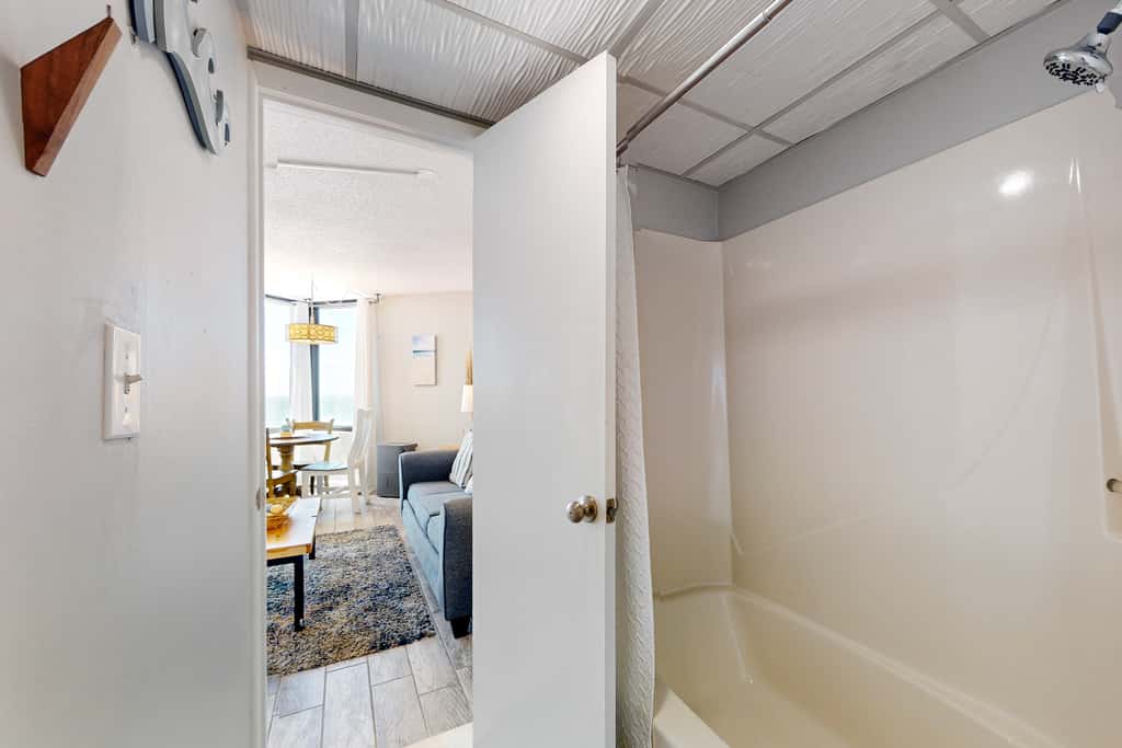 Gulf-view condo with pools, beach access, gym, grills, & updated interior