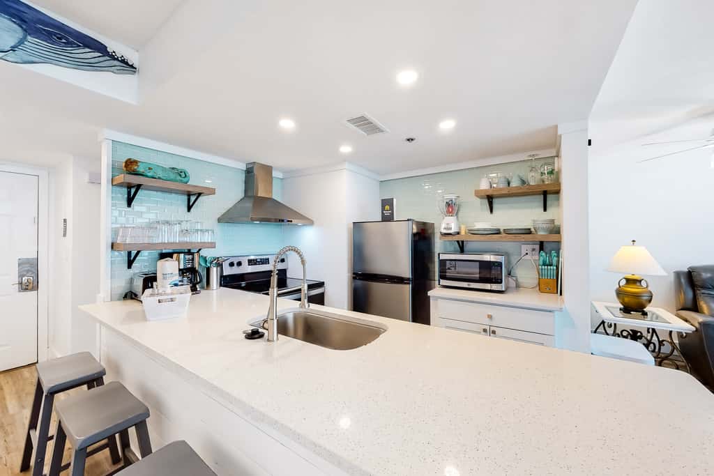 Beachfront condo with a private balcony, three pools, tennis, & picnic area