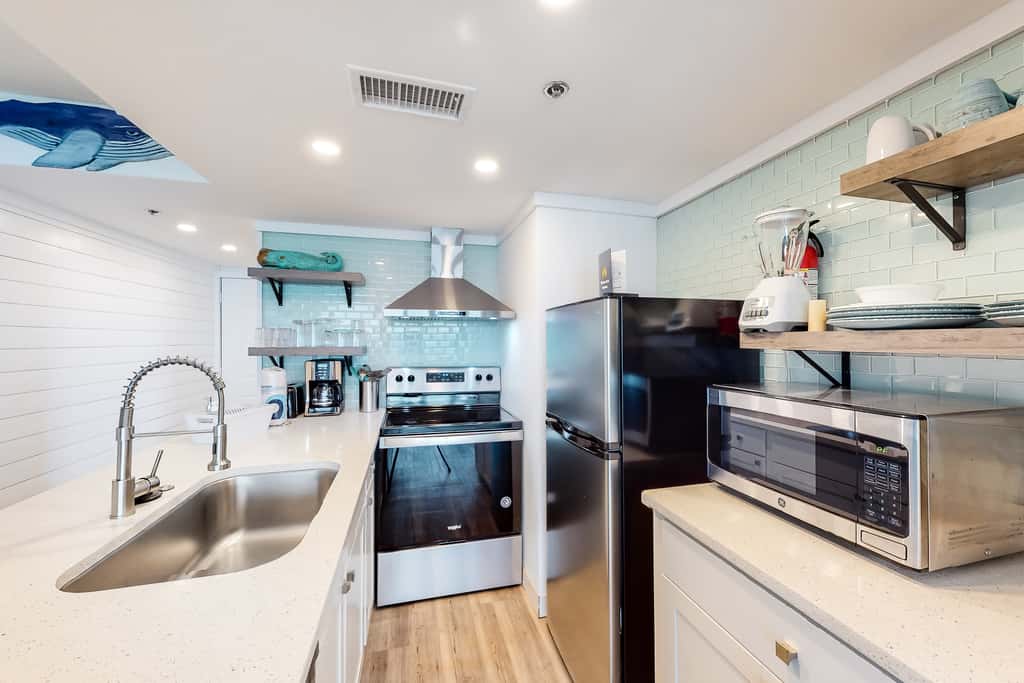 Beachfront condo with a private balcony, three pools, tennis, & picnic area