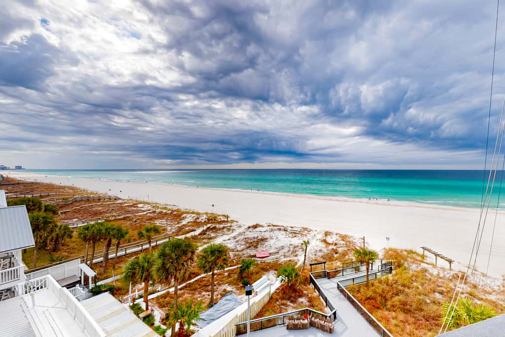 Beachfront condo with a private balcony, three pools, tennis, & picnic area