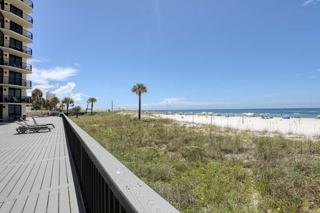Beachfront condo with a private balcony, three pools, tennis, & picnic area