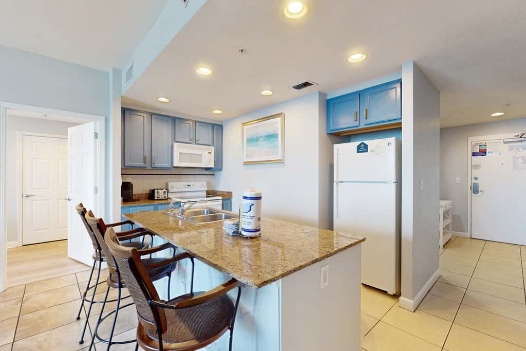 Tropical-themed condo with bi-level pool, fitness center & beach access