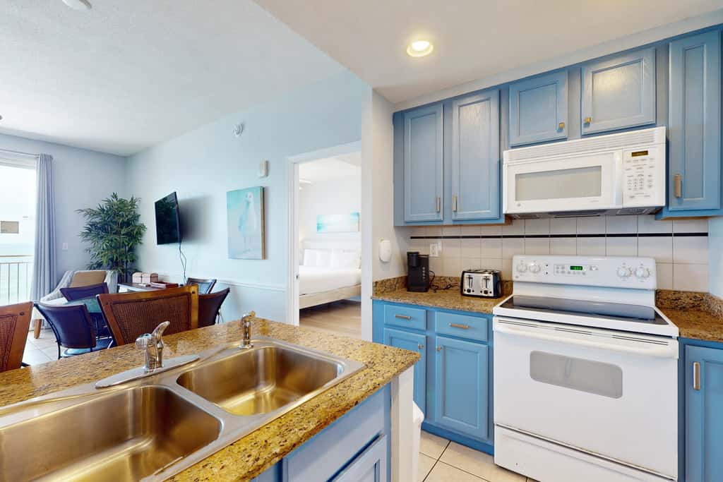 Tropical-themed condo with bi-level pool, fitness center & beach access